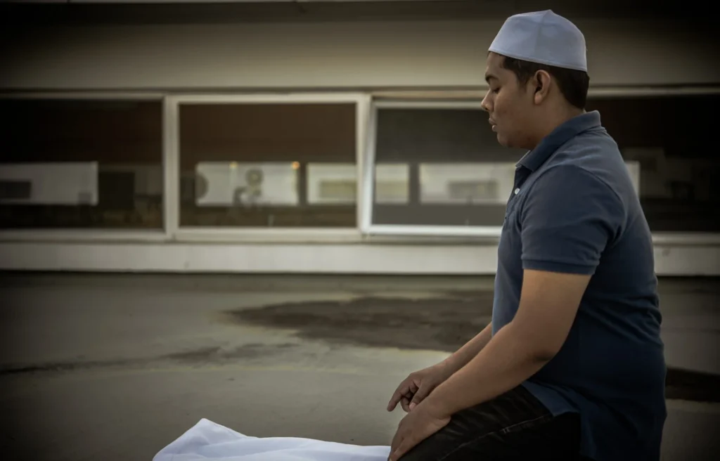 young asian muslim man praying sunsetramadan festival concept Custom