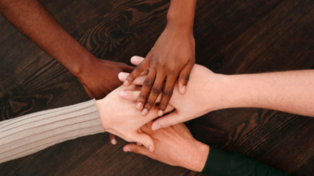 Diversed hands stacked together