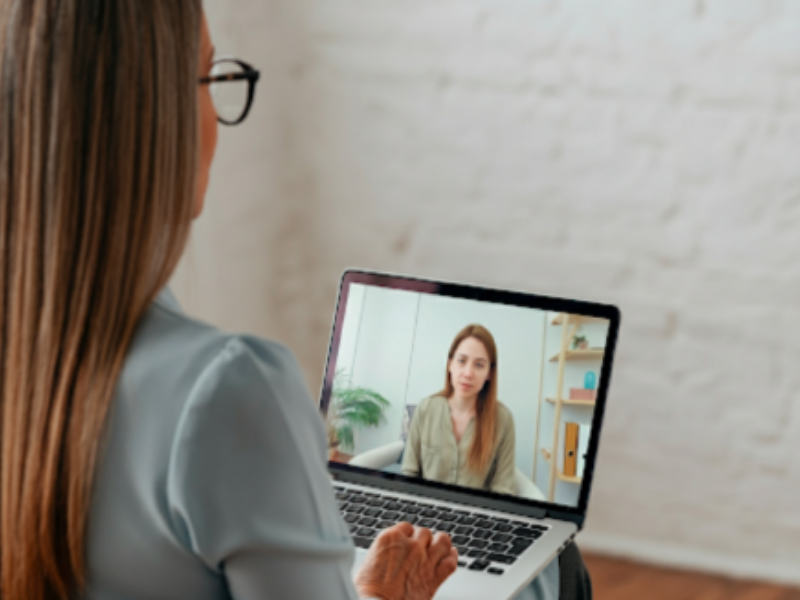Engaging in a telehealth session, with a therapist.